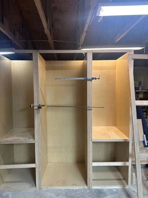 Cabinet boxes and shelving under construction in the shop