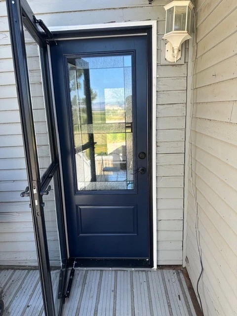 A replacement window fitted and trimmed on a home exterior